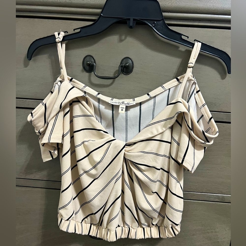 Cream colored crop top with black stripes